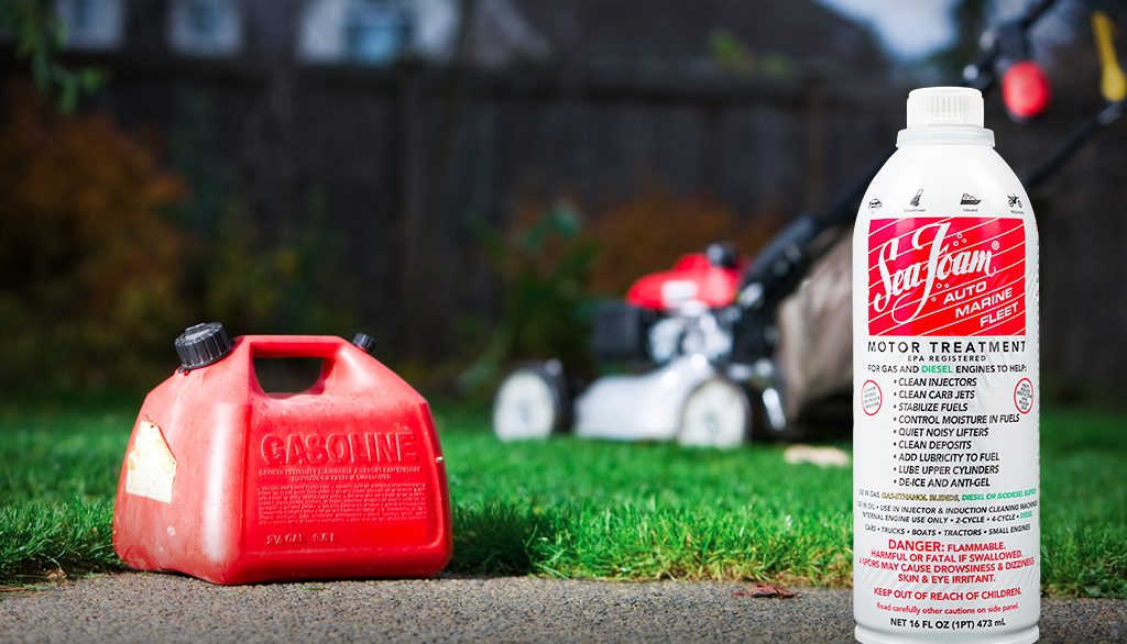 Sea Foam Motor Treatment in front of Lawn Mower and Gas Tank
