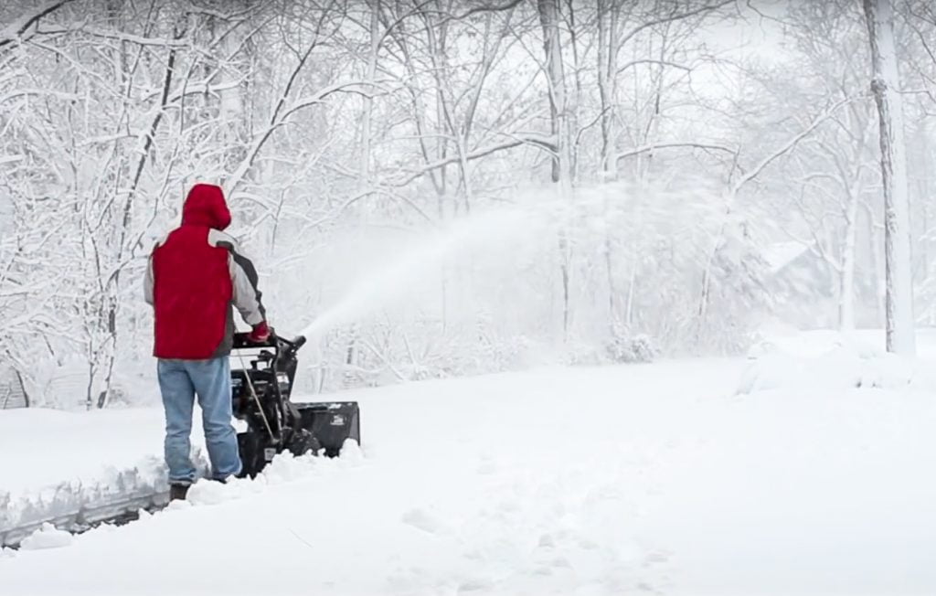 Guy Snow Blowing